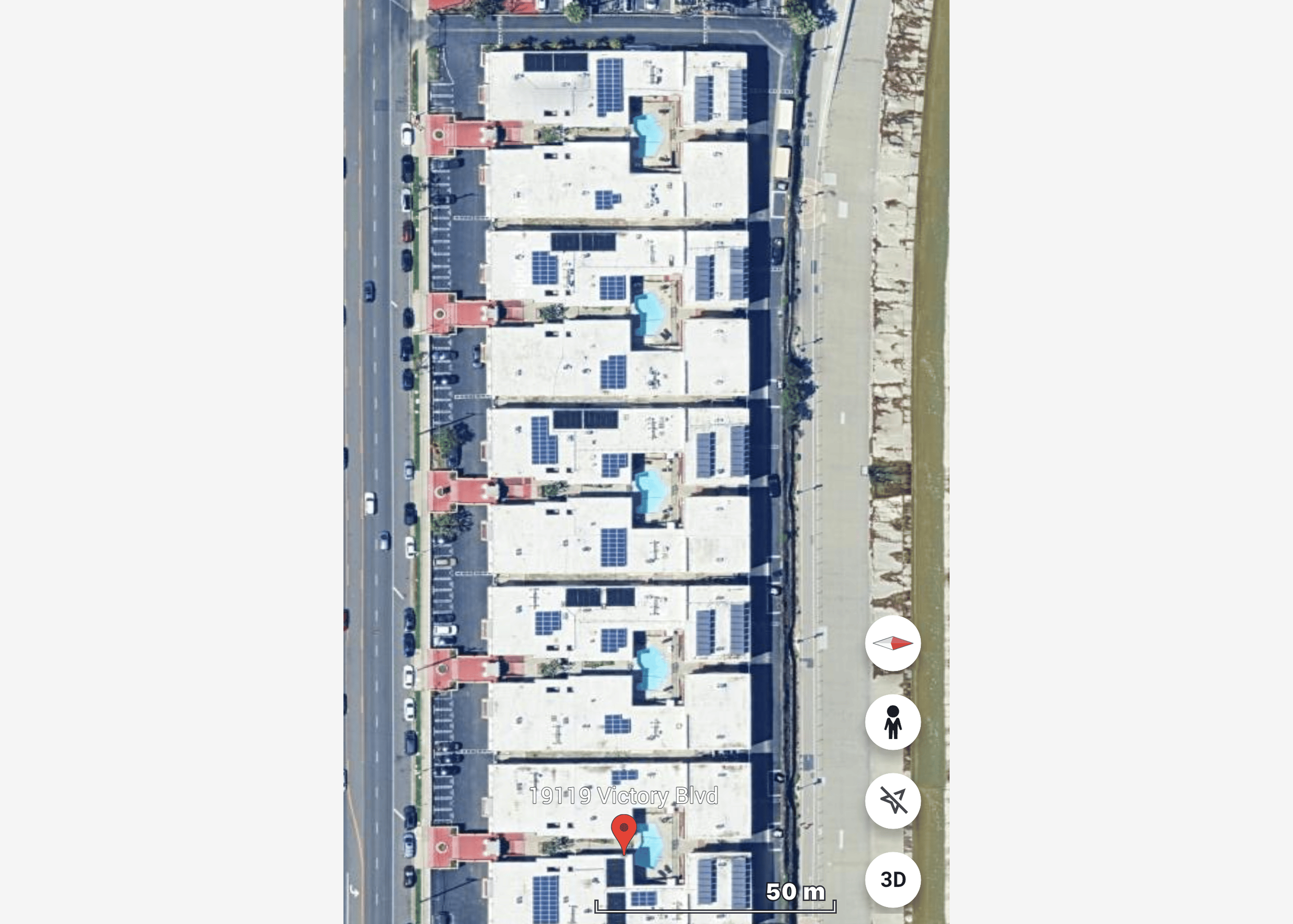 Aerial view of buildings with solar panels.